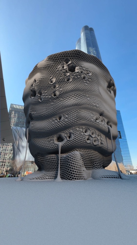 A grayscale 3D blocking render shows the high-detail organic sculpture placed within the city environment