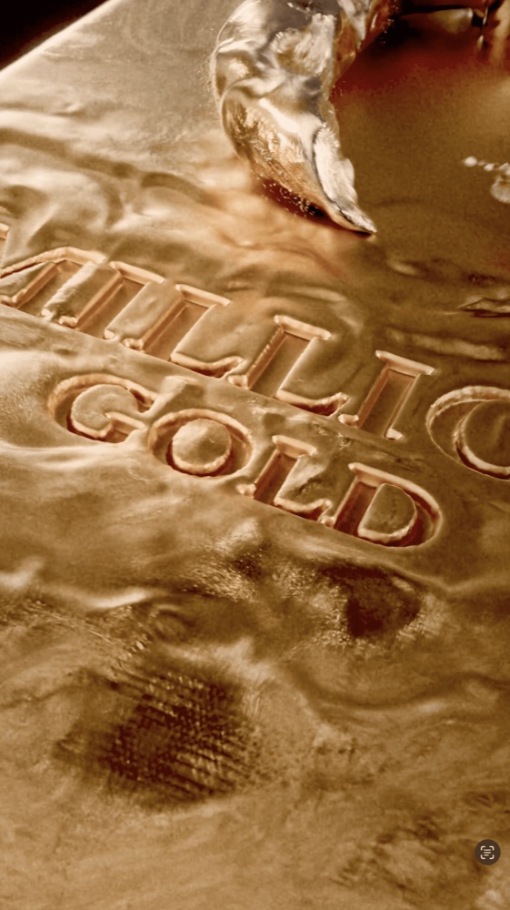Liquid gold flows over the embossed "MILLION GOLD" text on a metallic surface